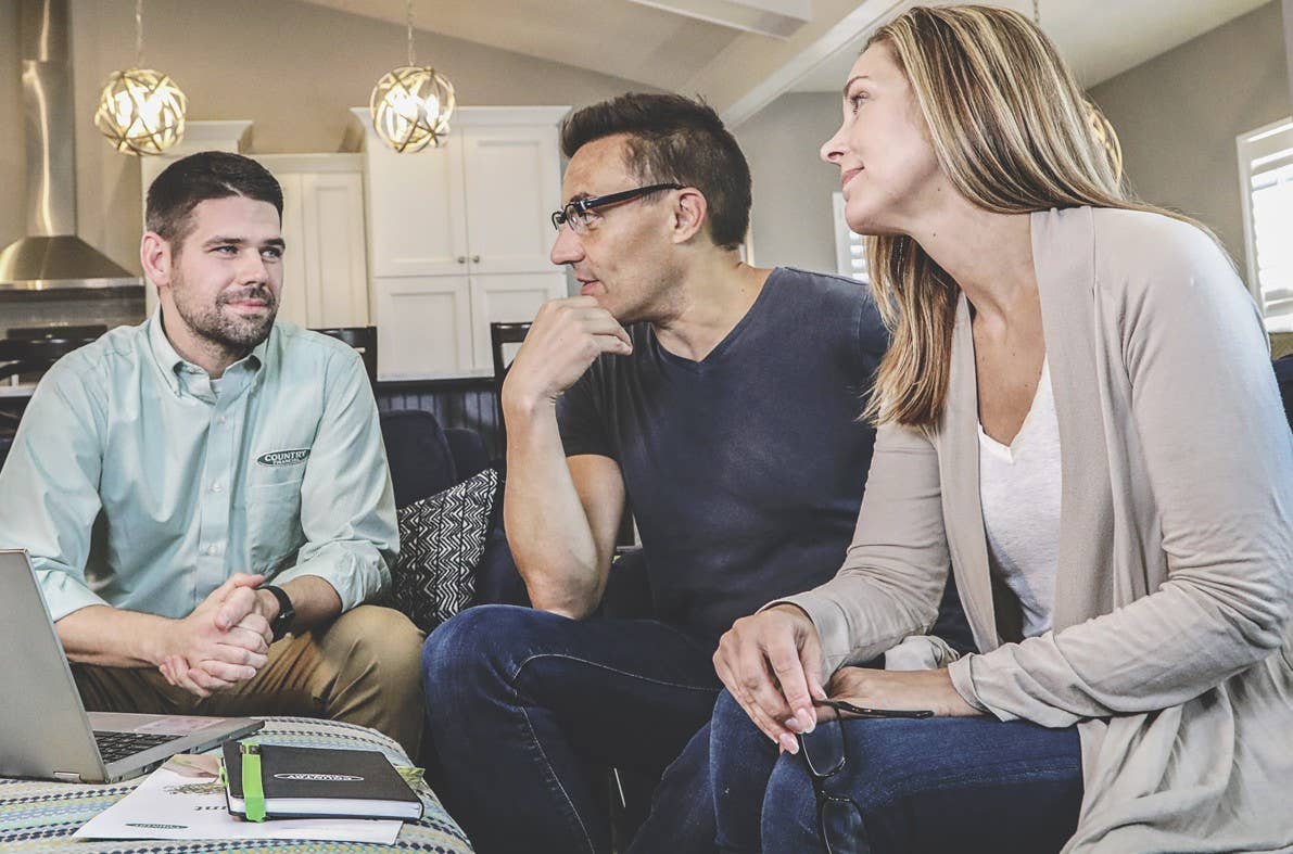 couple talks to rep in living room
