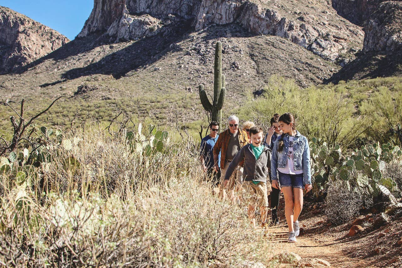 Family hiking in desert