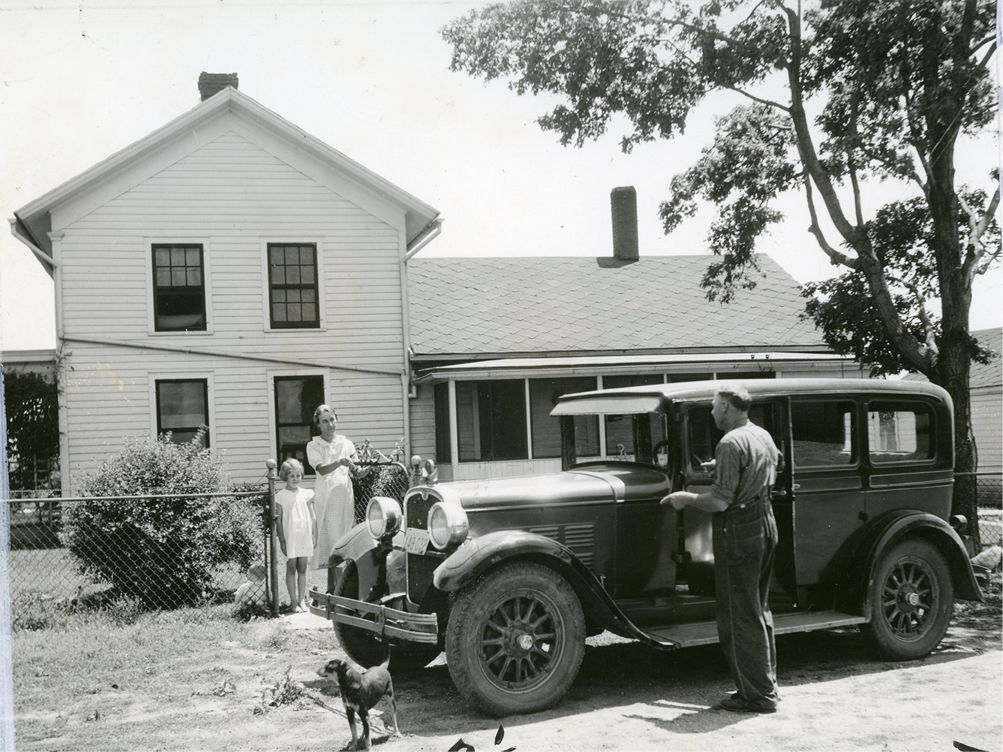 1925 - A farmer and his family outside a farmhouse
